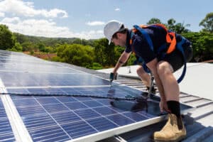 A Professional Installing a Solar System