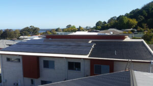 Solar Panel on Roof of Brick-Walled Building