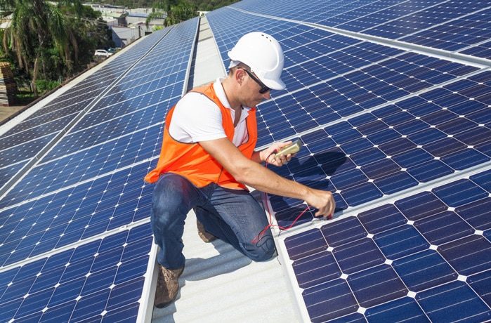 Technician Testing Solar Panel — Solar Power Services in Erina, NSW