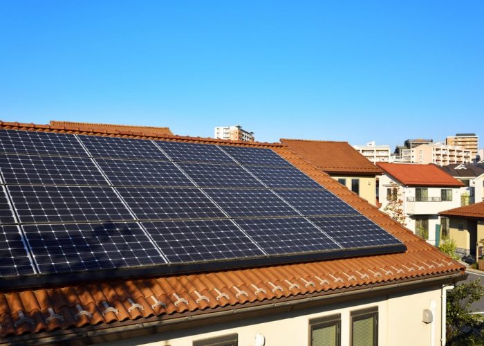 A Solar Panel On Red Roof