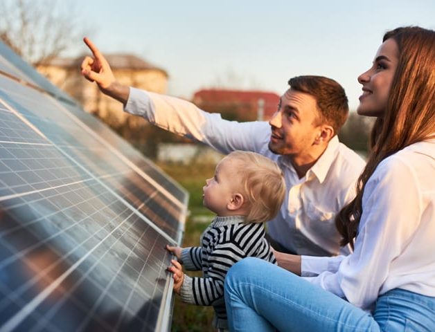 Family Looking at a Solar Panel — Solar Power Services in Bateau Bay, NSW