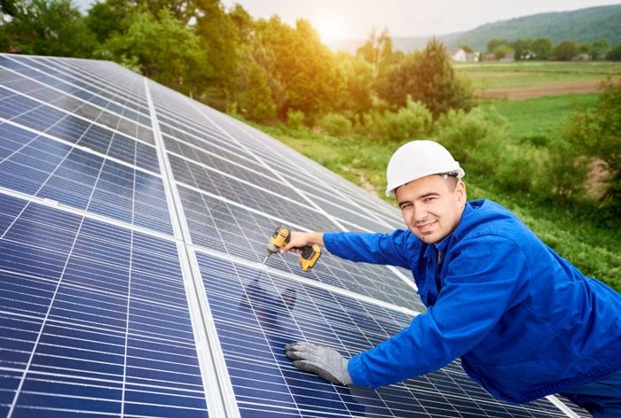 Technician Working on Solar Panels — Solar Power Services in Erina, NSW
